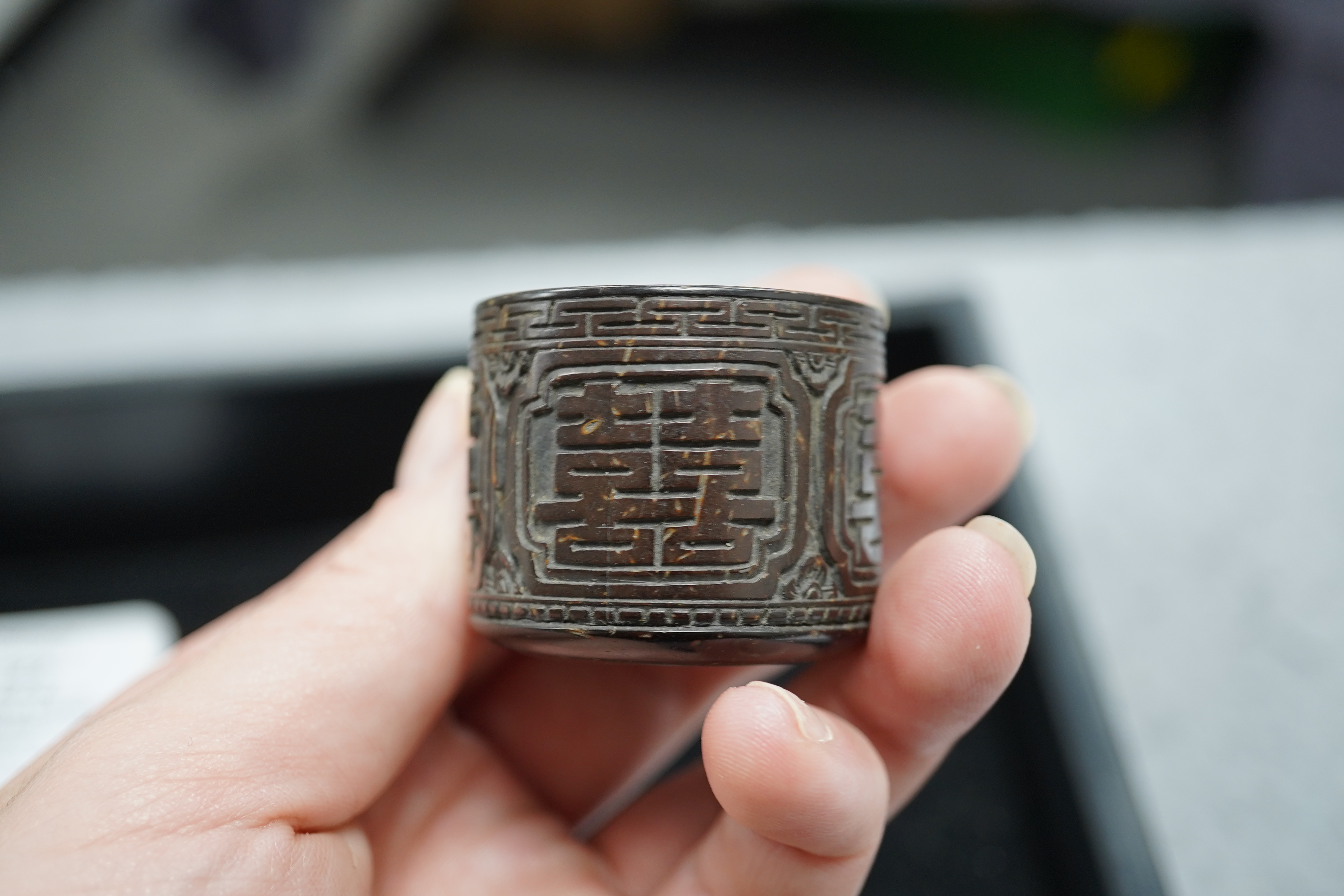 A pair of rare Chinese Straits palm wood archer's thumb rings, 19th century